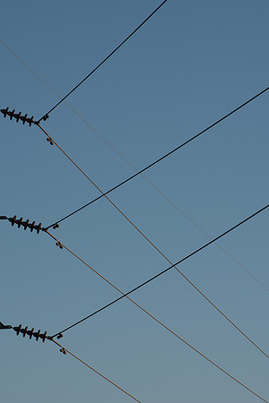 Crossing Power Lines Against the Sky Vert