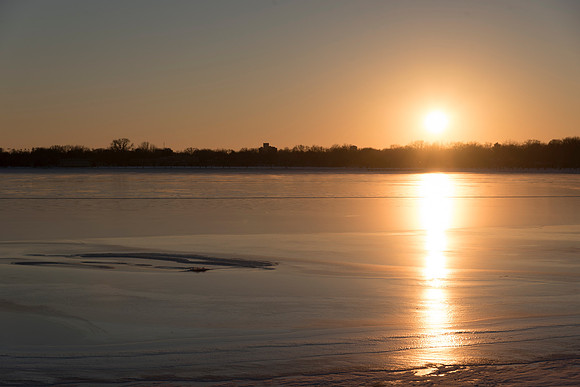 Sunset Reflection on Frozen Lake
